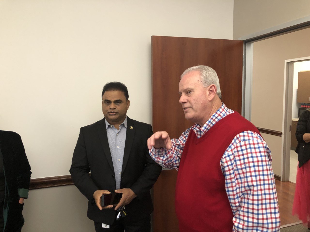 Fort Bend County Judge KP George visits with Fort Bend County Pct. 1 Commissioner Vincent Morales at the Dec. 7 opening of Morales’s new precinct office at 22333 Grand Circle Road.